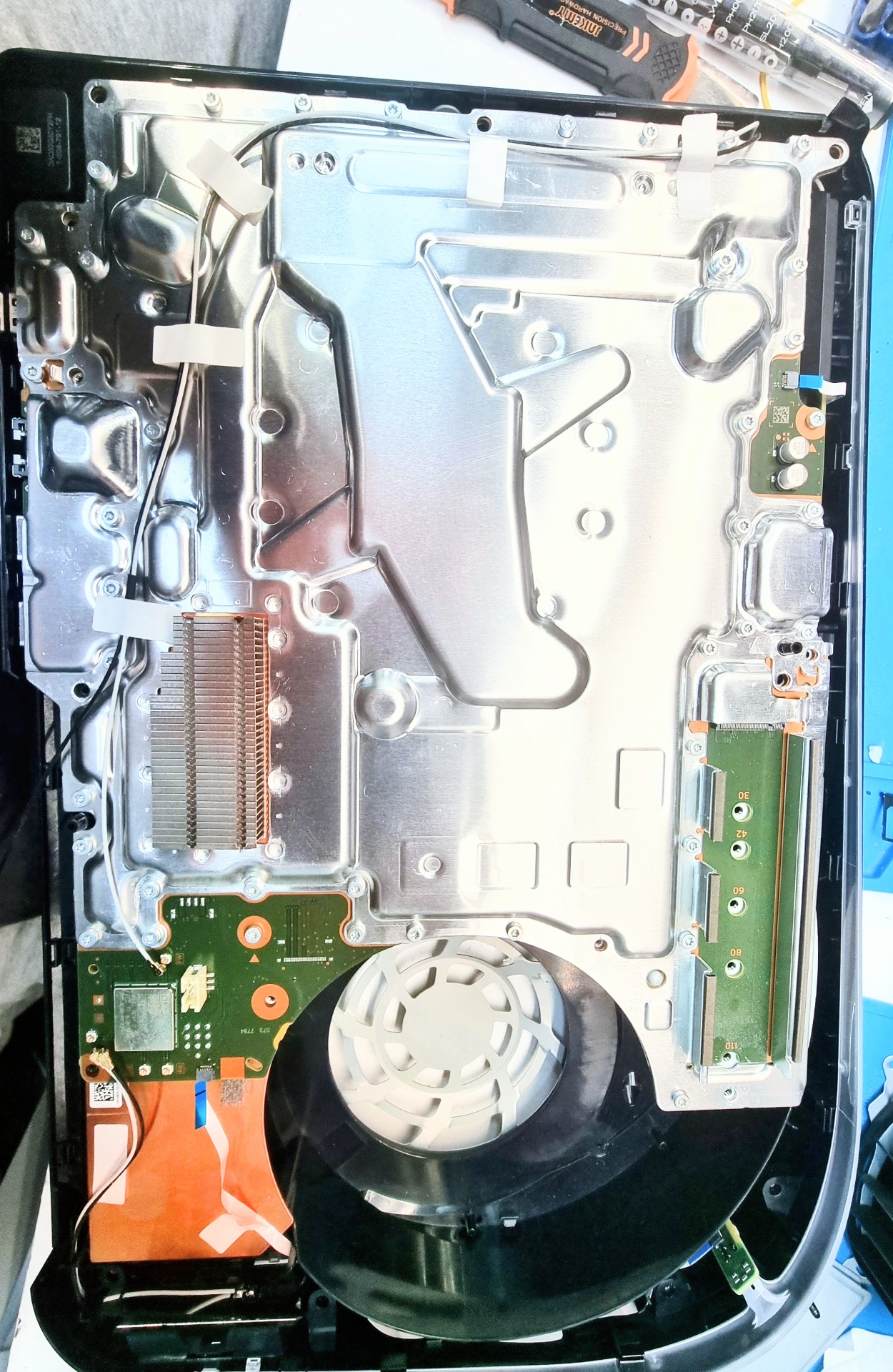 Genuine opened PS5 console undergoing servicing at the Surrey workshop